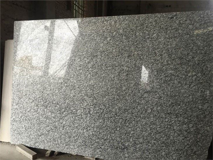 spray white granite tiles